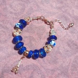 Rose gold snake chain charm bracelet with royal blue European beads
